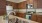a kitchen with wooden cabinets