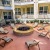 chairs and a fountain outside a building