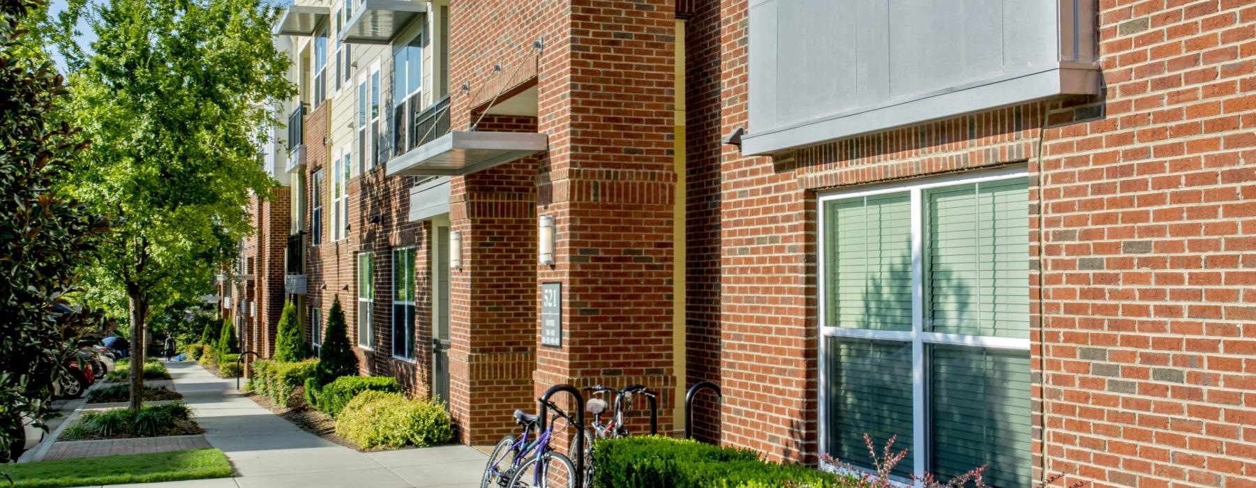 a brick building with a bike rack