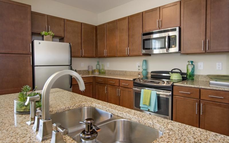 a kitchen with wooden cabinets