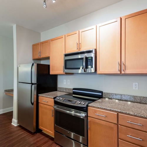 well lit kitchen with black appliances 