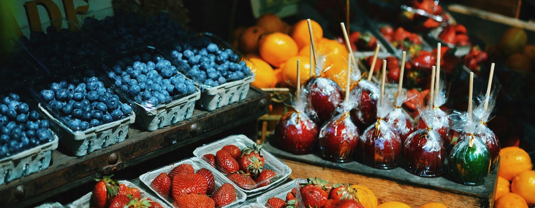 a fruit stand with strawberries